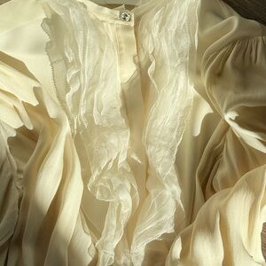Elegant ESCADA silk blouse in a soft off-white tone.
